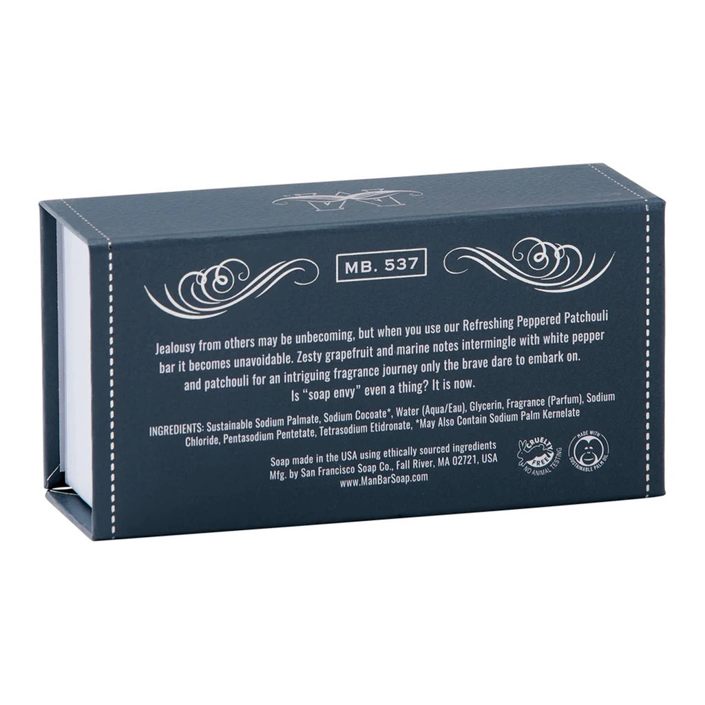 Man Bar Refreshing Peppered Patchouli scented bar soap in navy blue packaging, back angle view.