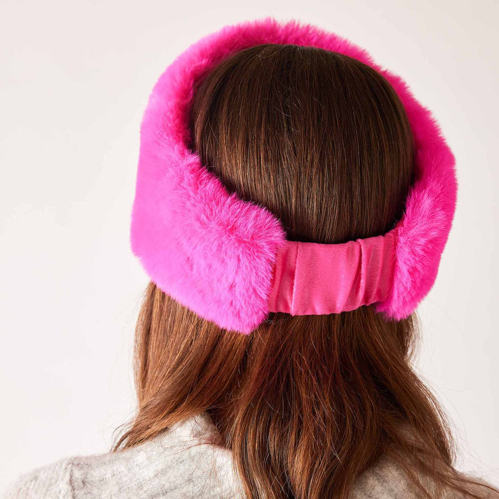 MERSEA Cozy Cabin Faux Fur Headband in hot pink, back view on model.