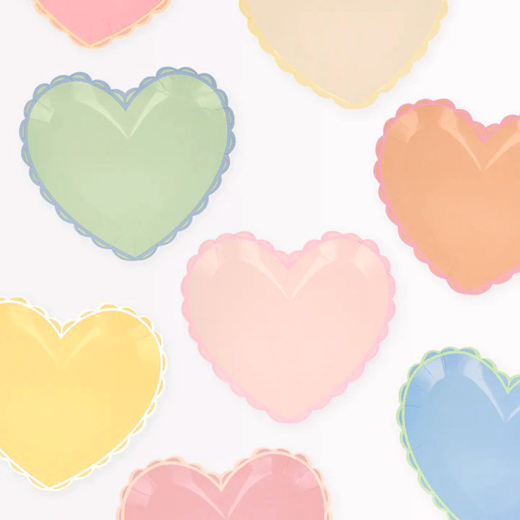 Meri Meri small pastel heart valentines day party plates with scalloped edges and contrasting color trim.