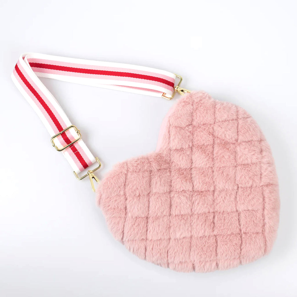 Meri Meri pink plush quilted heart shaped bag with red, pink and white striped web handle, overhead view.