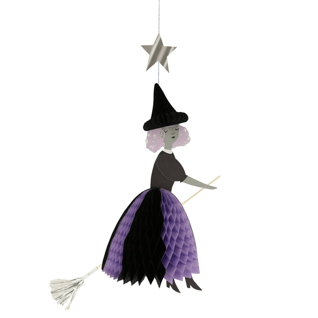 Meri Meri Flying Honeycomb Witch Halloween decorations, witch with black honeycomb hat, black and purple skirt on a wood dowel broomstick with silver broom and a silver star on hanging thread.