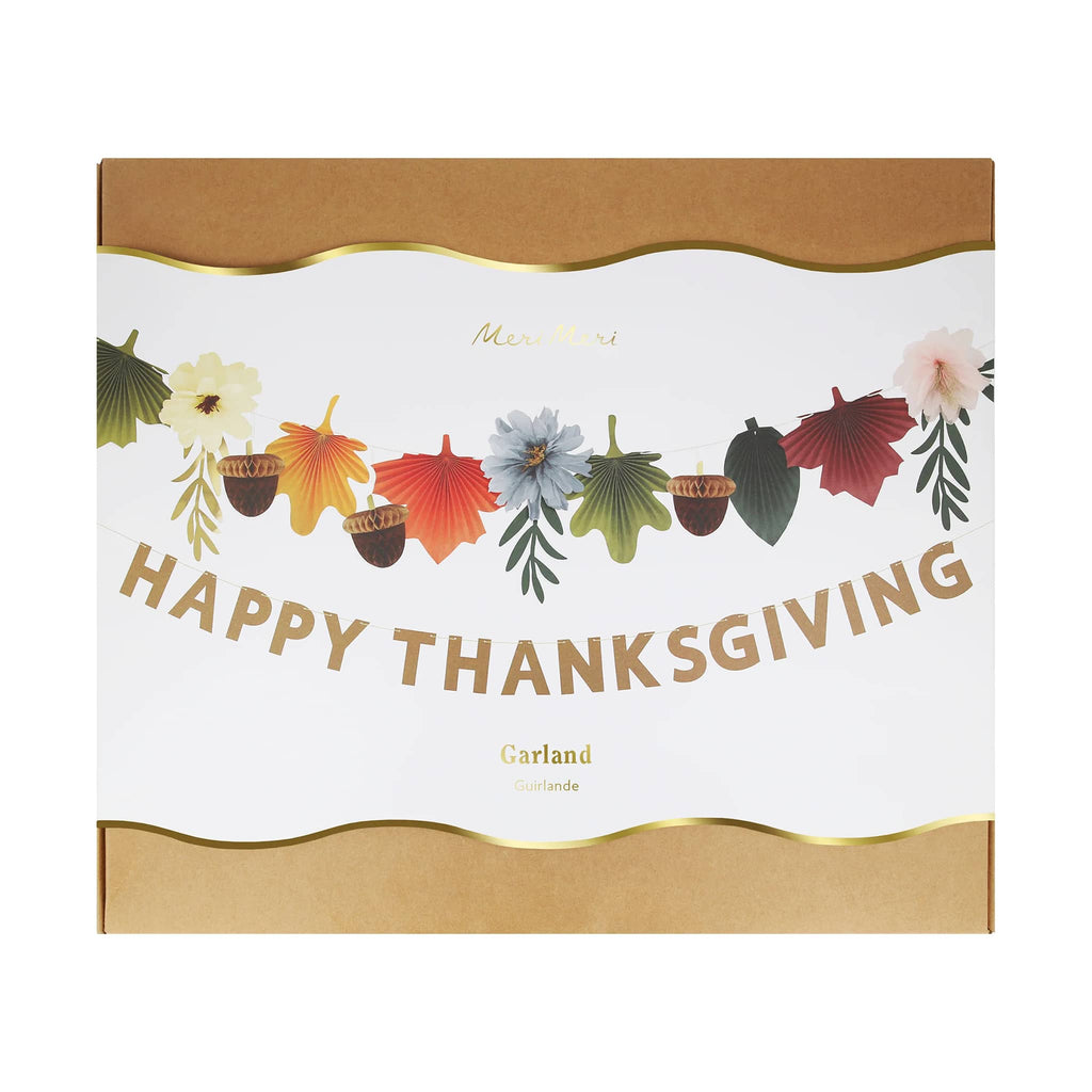 Meri Meri Happy Thanksgiving garland with honeycomb acorns, fan leaves and flowers in box packaging.