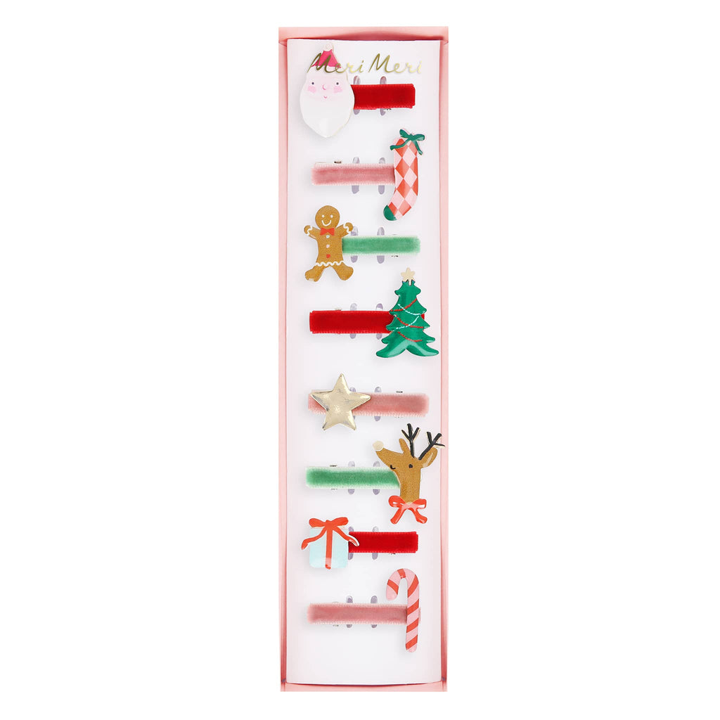 Set of Christmas-themed hair clips in a decorative box on a white background.