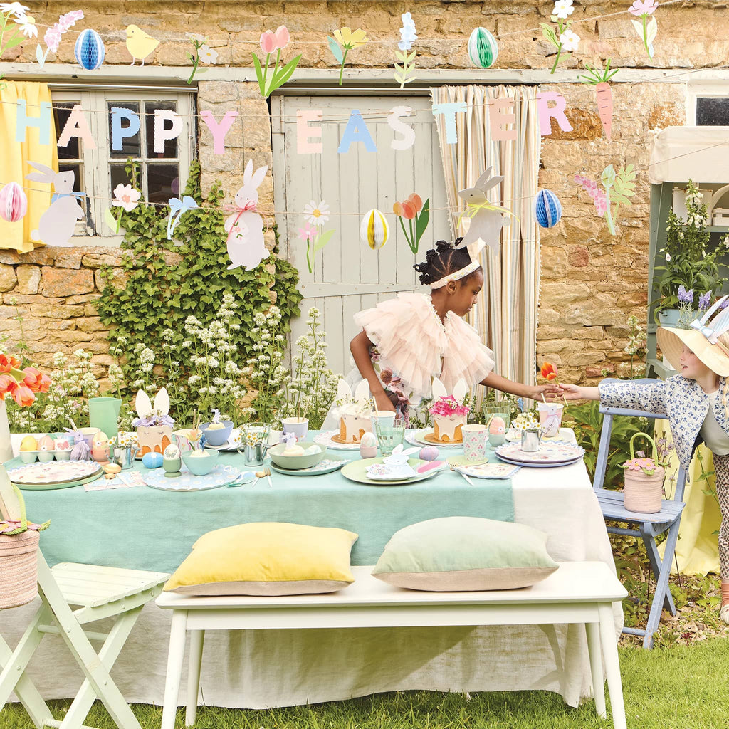 Meri Meri Happy Easter 3-strand party garland, shown in an outdoor party setting.