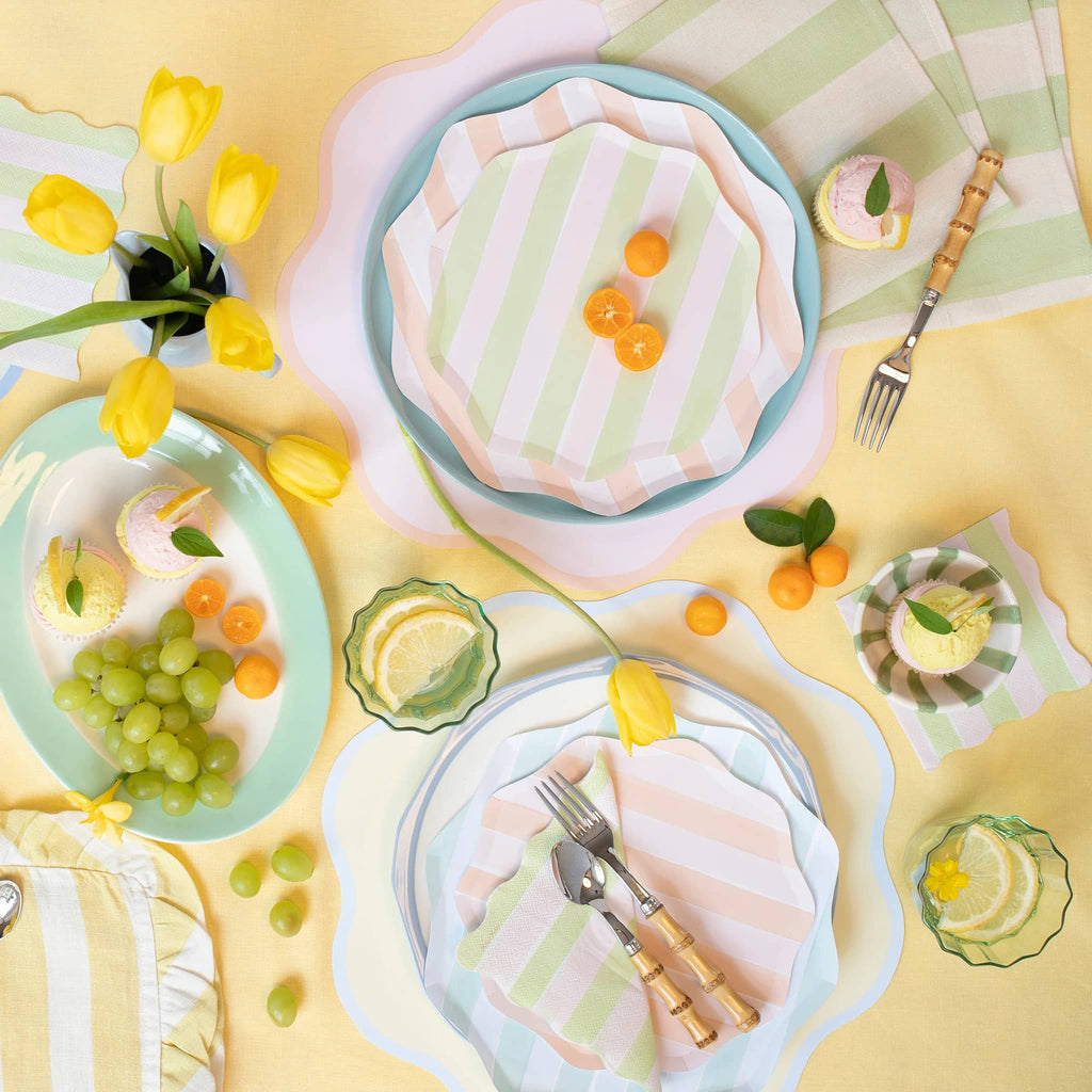 Meri Meri Pastel Stripe small paper party dinner plates in table setting.