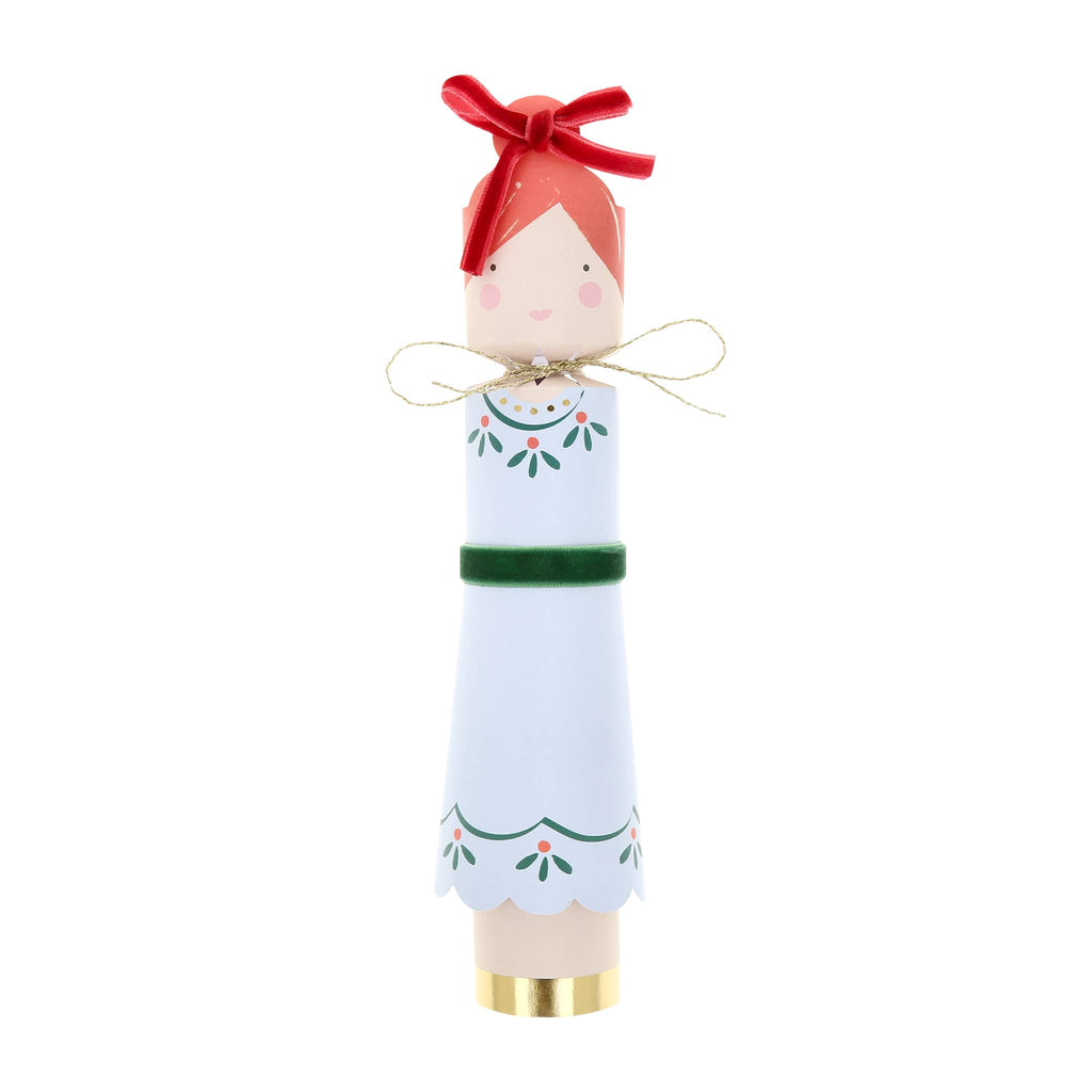 Holiday cracker of girl with red hair and a pale blue dress on a white background.