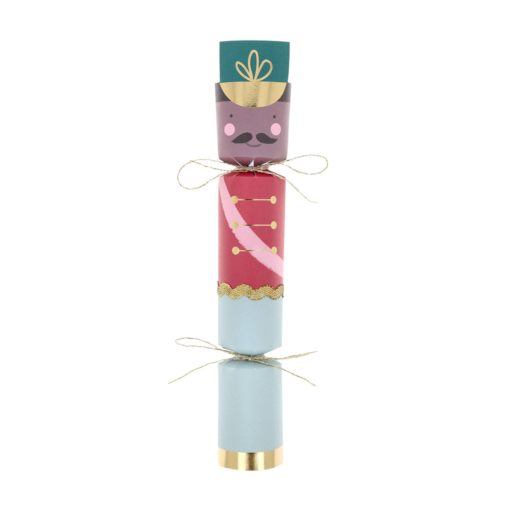 Holiday cracker of a nutcracker soldier on a white background.