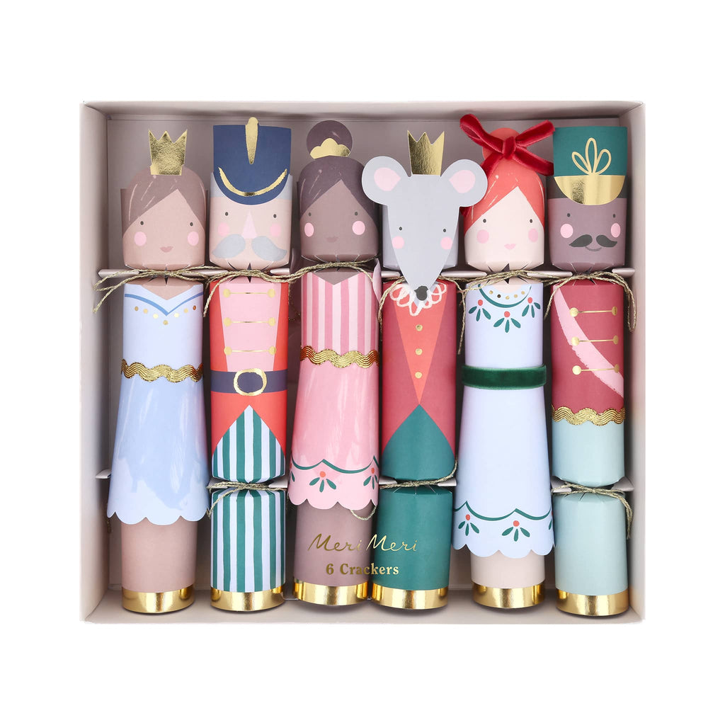 Set of colorful nutcracker ballet themed Christmas crackers with character designs in a box.