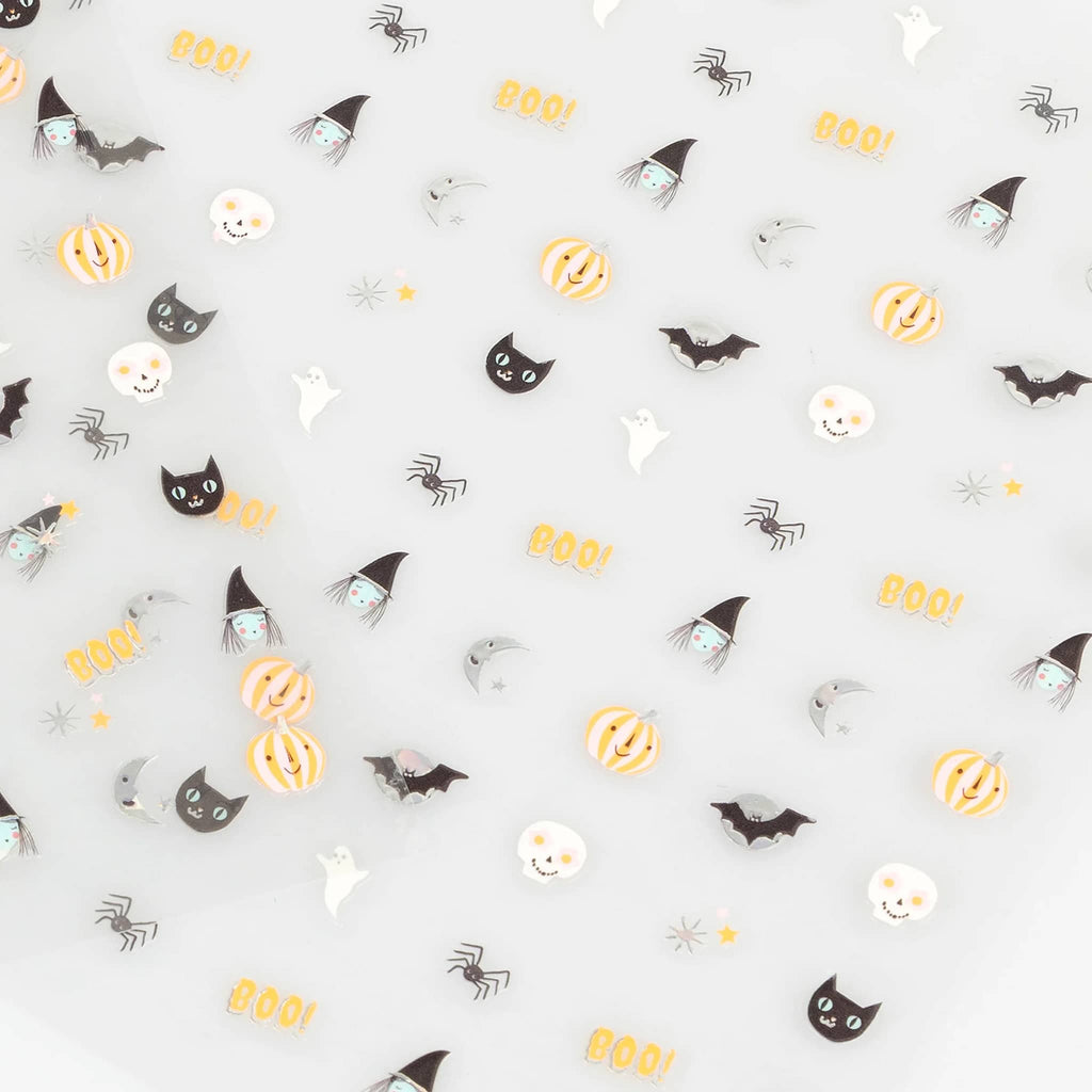 Halloween-themed nail stickers on a grey background.
