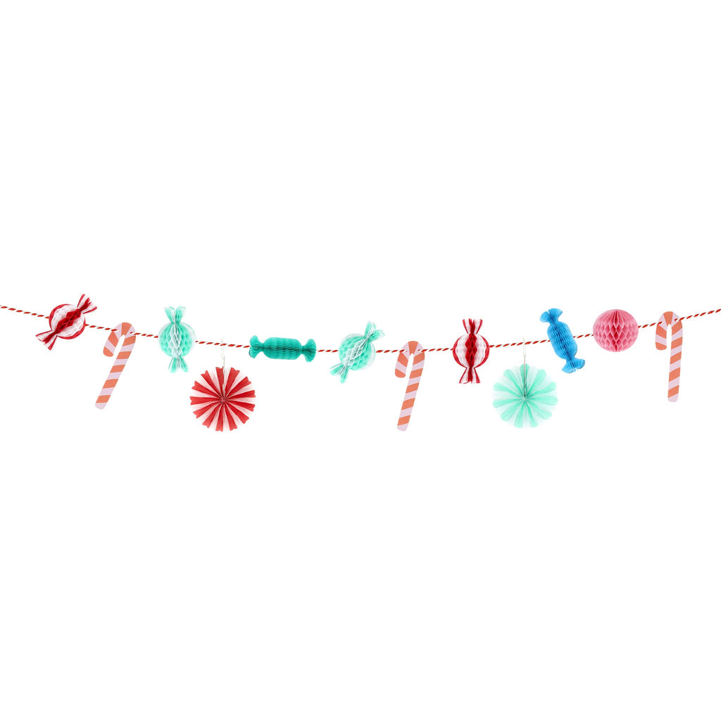Decorative string with colorful Christmas-themed candy honeycomb ornaments on a white background.