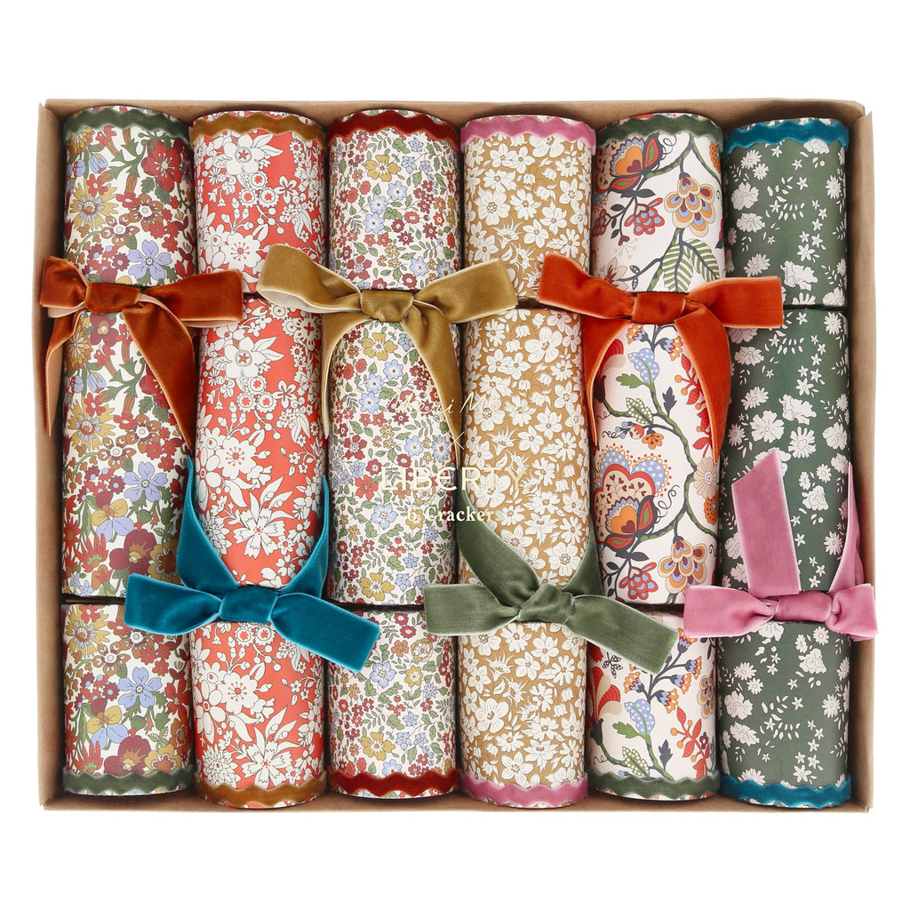 Set of floral-patterned crackers with colorful bows in a box.