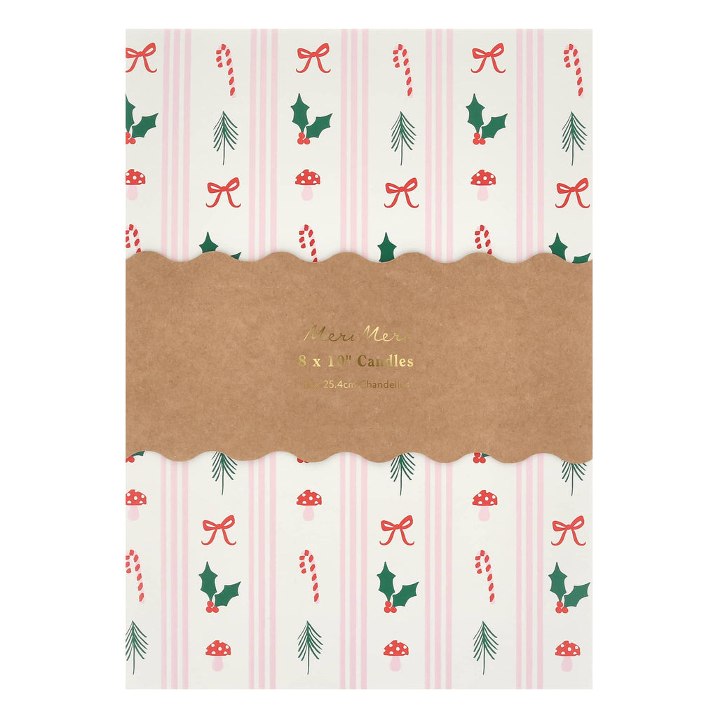 Packaging for candles with Christmas-themed design on a white background.