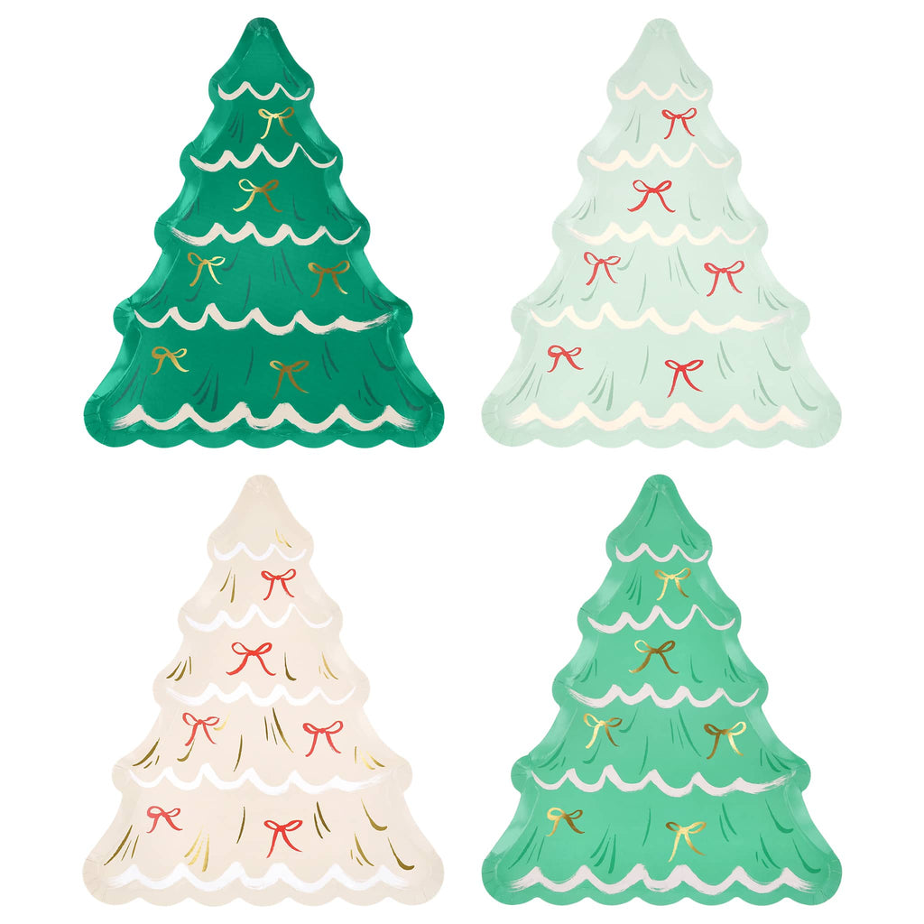 Four decorative Christmas tree shaped plates with bows on a white background.