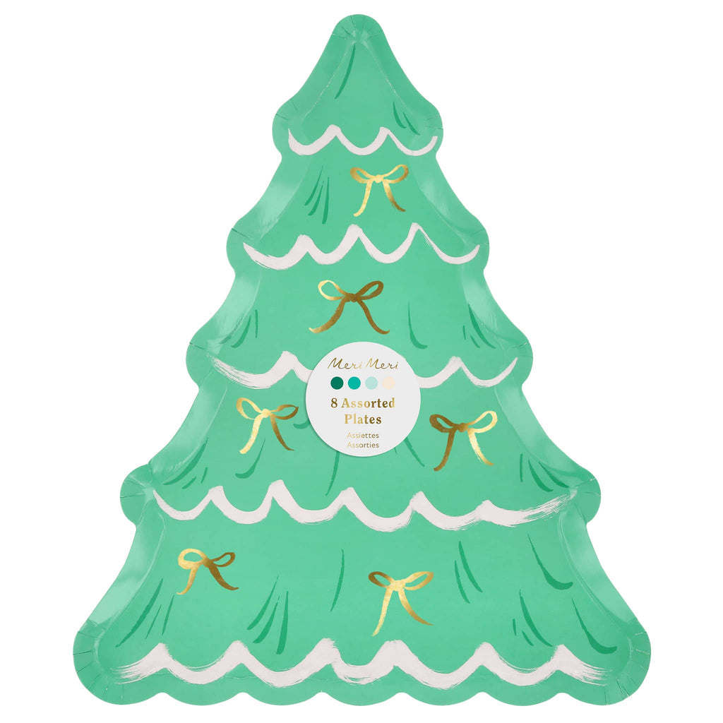Green Christmas tree-shaped plate with gold bows on a white background.