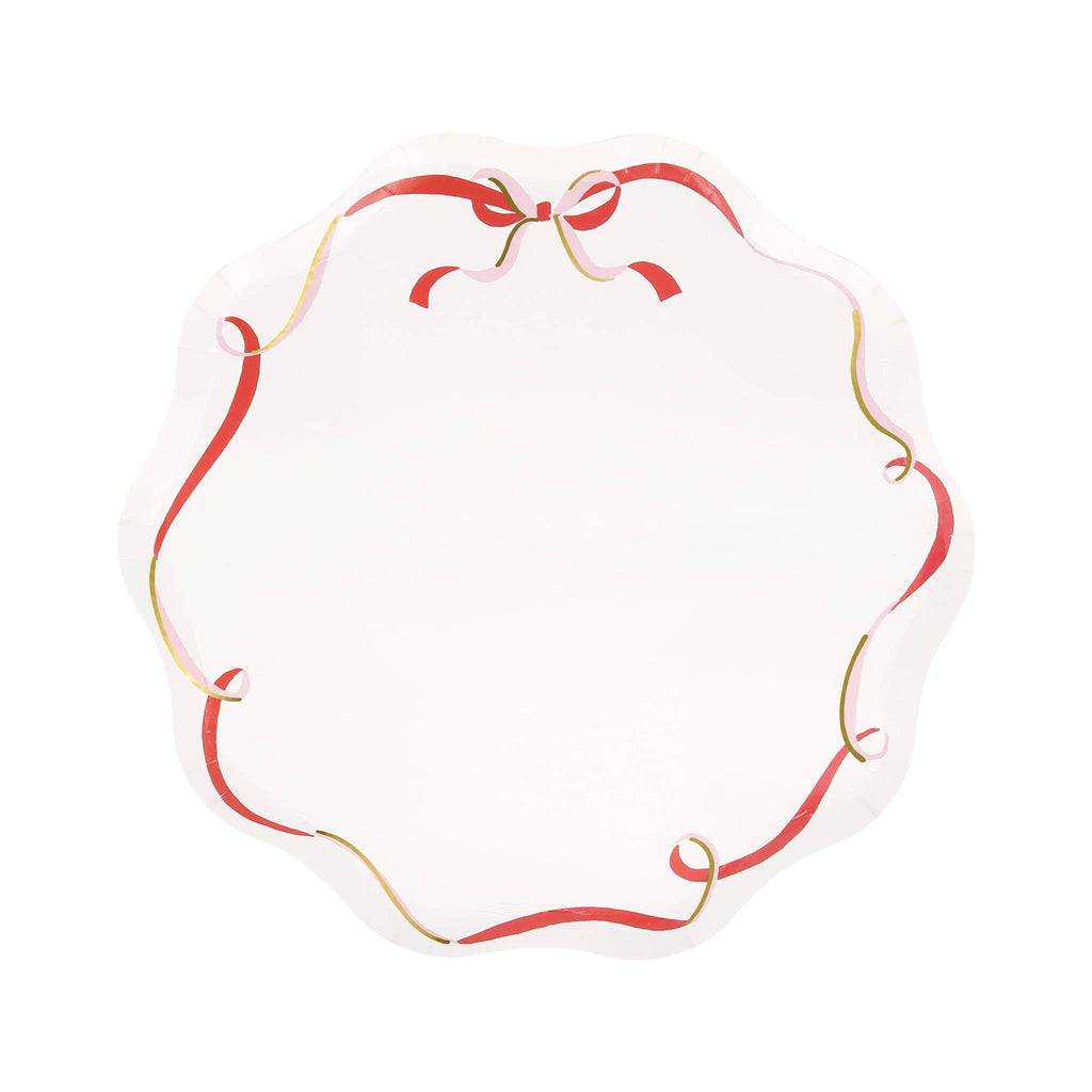 Decorative paper plate with red, pink and gold ribbons and bow, on a white background.