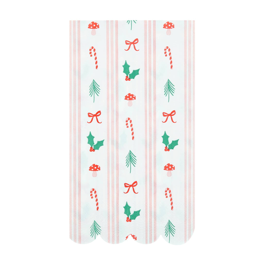 Decorative paper guest towels with Christmas-themed designs on a white background.