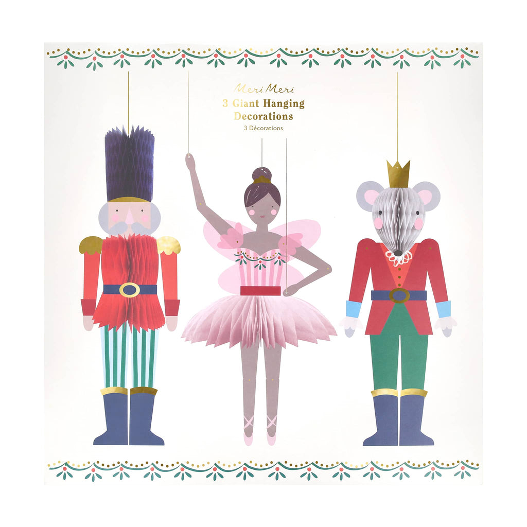 Three giant hanging decorations of a nutcracker, ballerina, and mouse king in box, on a white background.