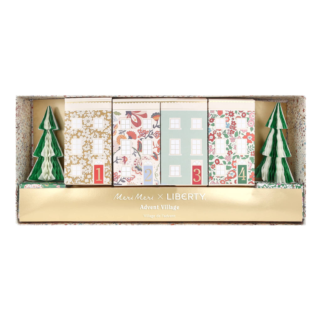 Advent calendar with festive designs and trees, featuring the brand 'Liberty' and "Meri Meri".