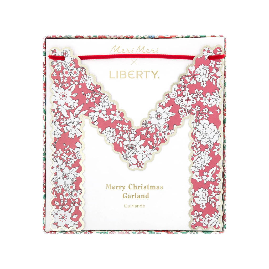 Floral letter 'M' garland packaging with Liberty branding on a white background.