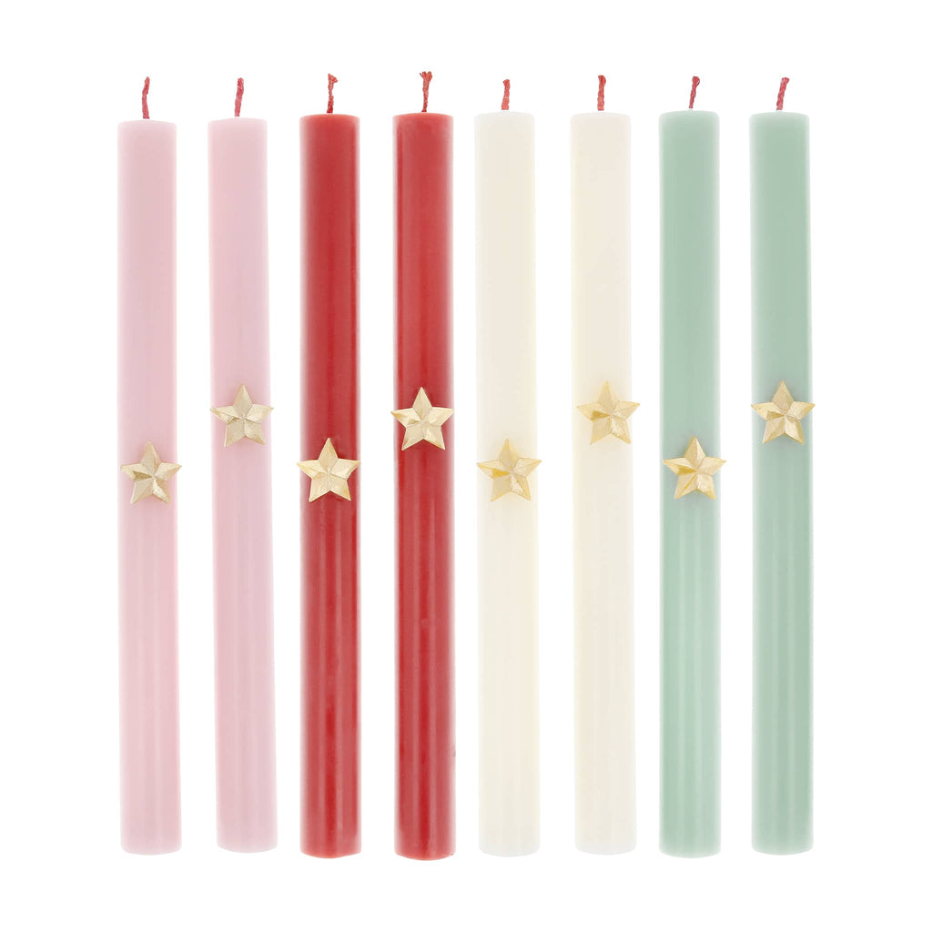 Set of colorful candles with star decorations on a white background.