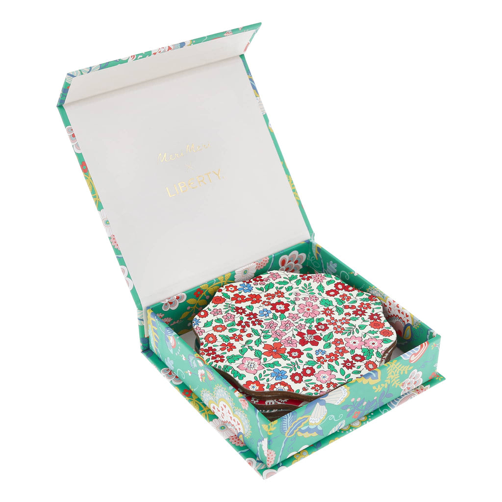 Floral-patterned coasters in a matching box on a white background.