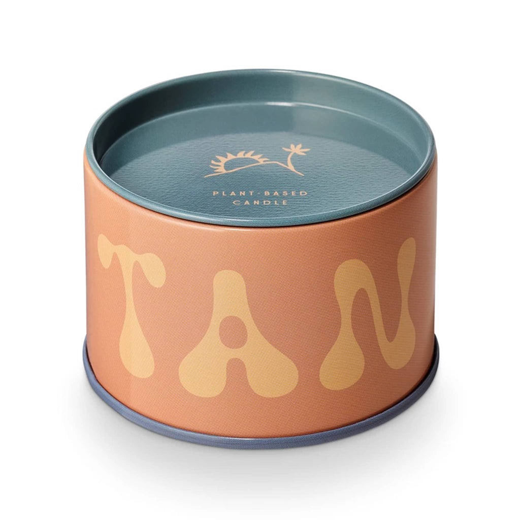 MiscMatch Tan Lines scented soy wax candle in tin with "tan" on it and lid.