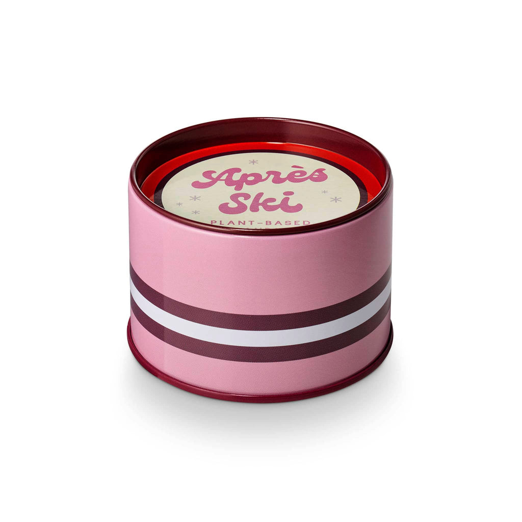 Pink cylindrical tin with red and white stripes and 'Apres Ski' text on a white background.