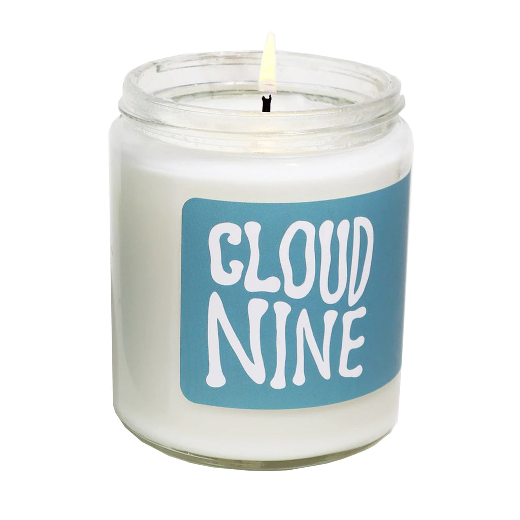 MOCO Candles Cloud Nine scented soy wax candle in clear glass jar with white metal lid and blue label with white lettering.