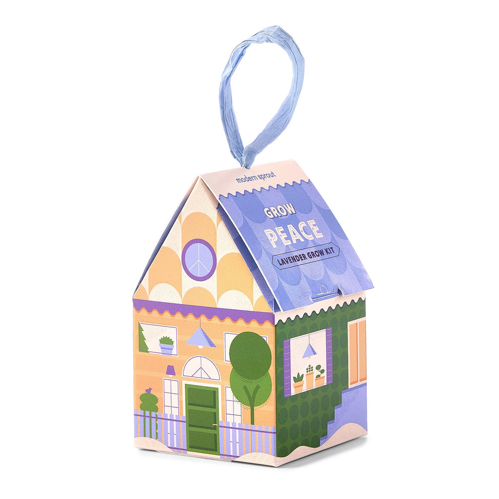 Modern Sprout Home Grown Ornament in Grow Peace, Lavender grow kit in house-shaped box ornament with raffia  hanger, front angle view.