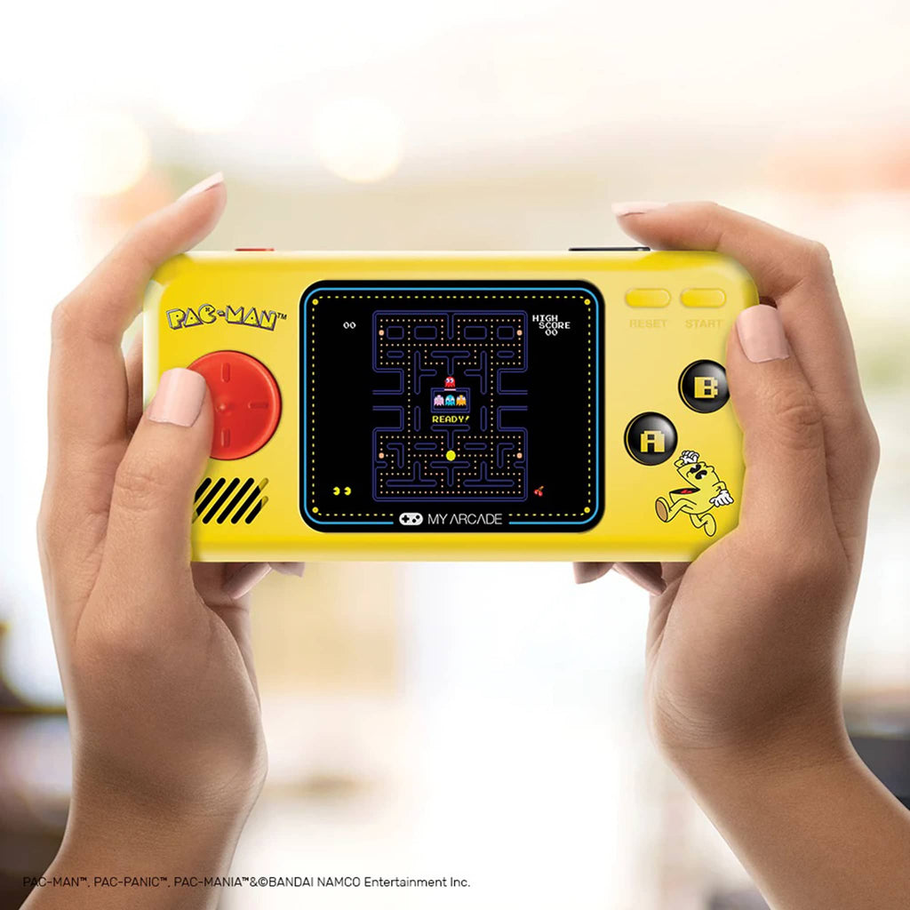 Dreamgear My Arcade Pac-Man Pocket Player portable gaming system in hands for scale.