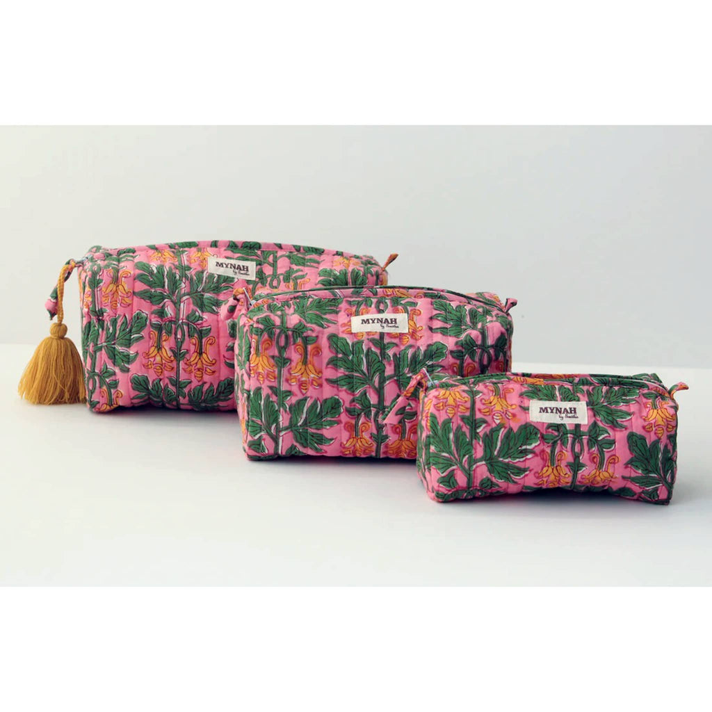 MYNAH by Smitha Bubblegum Forest print large, medium and small quilted travel makeup pouches, front view.