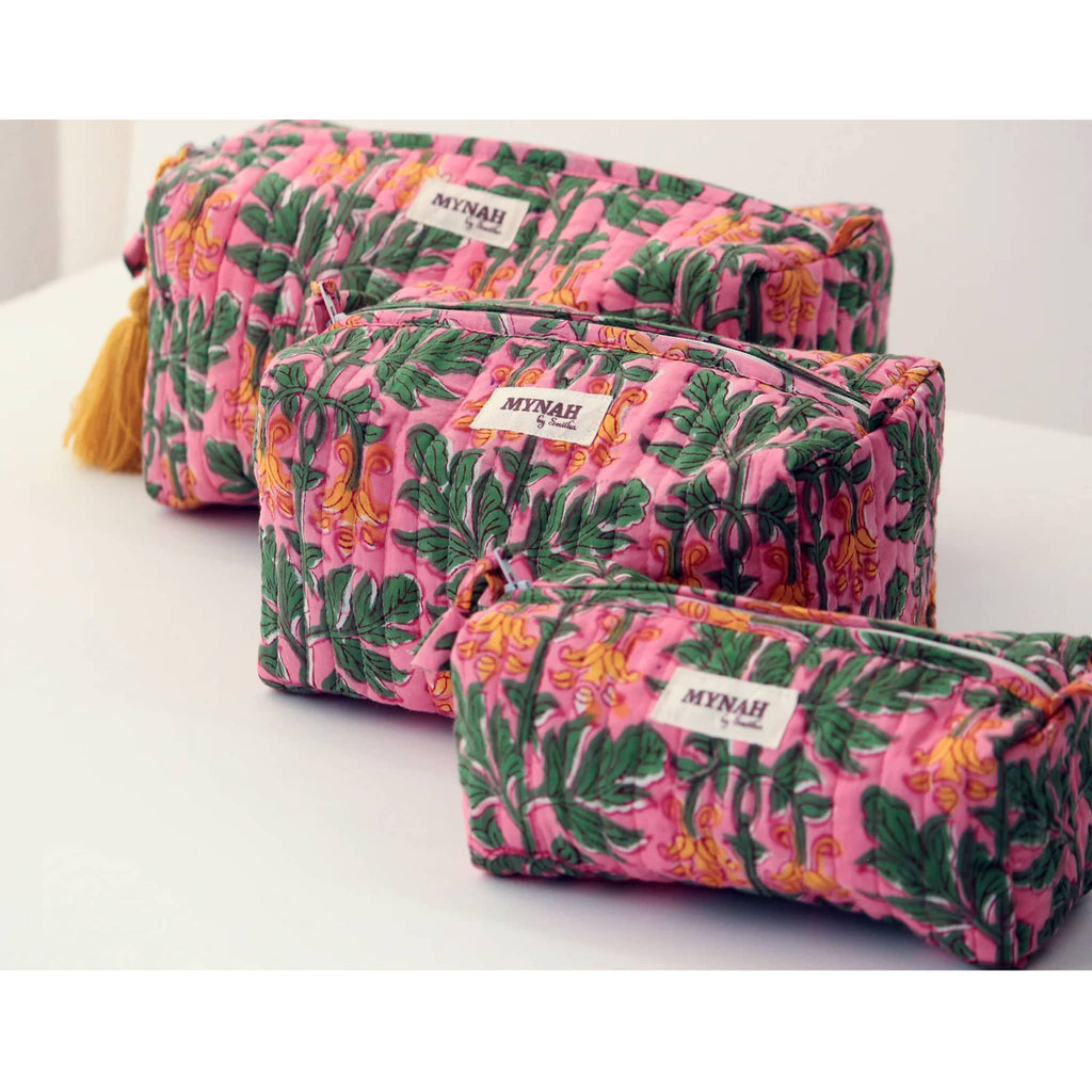 MYNAH by Smitha Bubblegum Forest print large, medium and small quilted travel makeup pouches, front angle view.