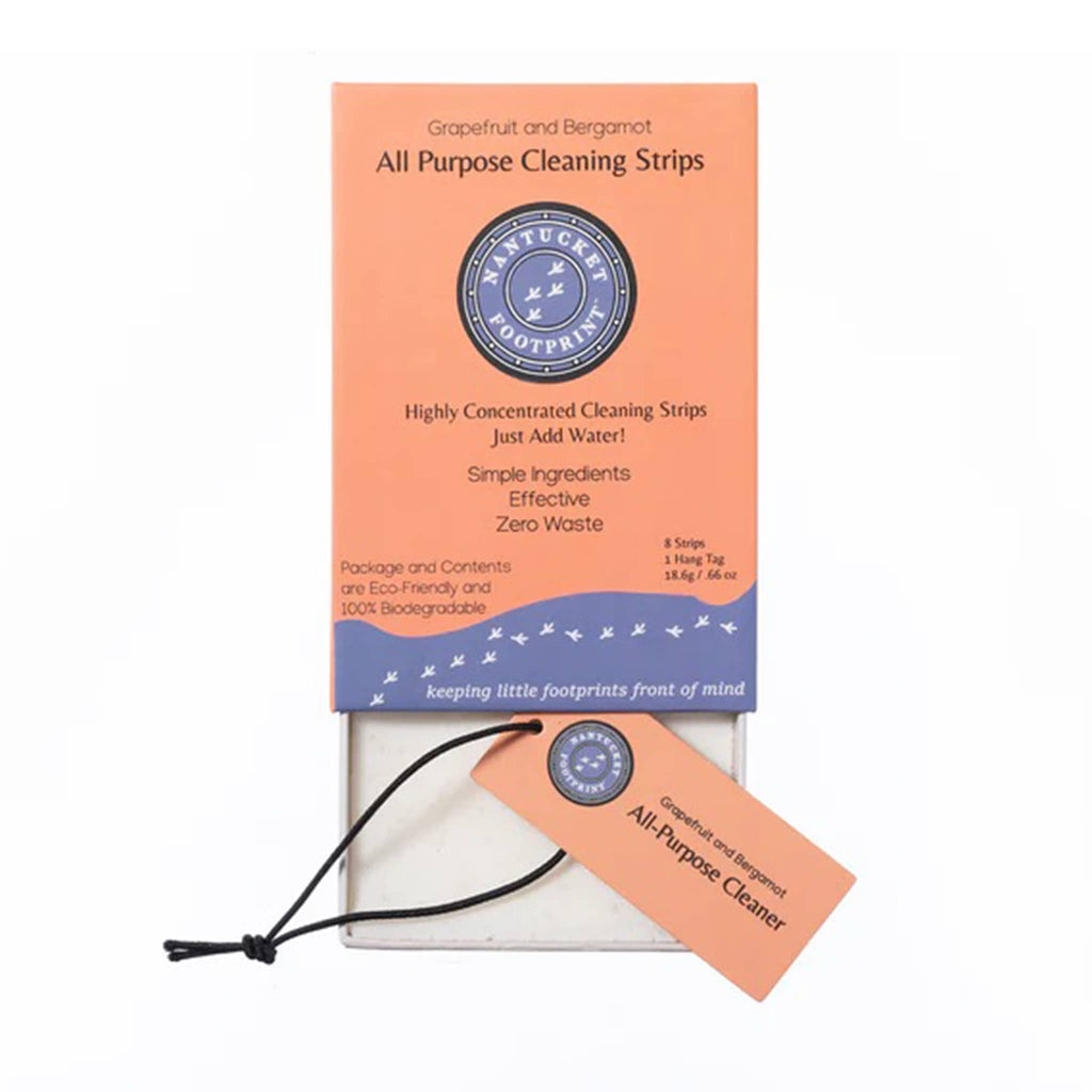 Nantucket Footprint Grapefruit and Bergamot highly concentrated all-purpose cleaner strips in orange box packaging, front view with drawer pulled out and included hang tag showing.