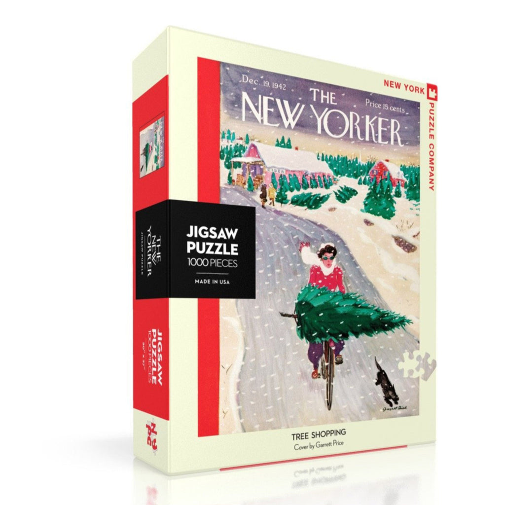 New York Puzzle Company 1000 piece Tree Shopping New Yorker cover holiday jigsaw puzzle with a woman riding a bike in the snow with a tree across her handlebars, box front angle view.