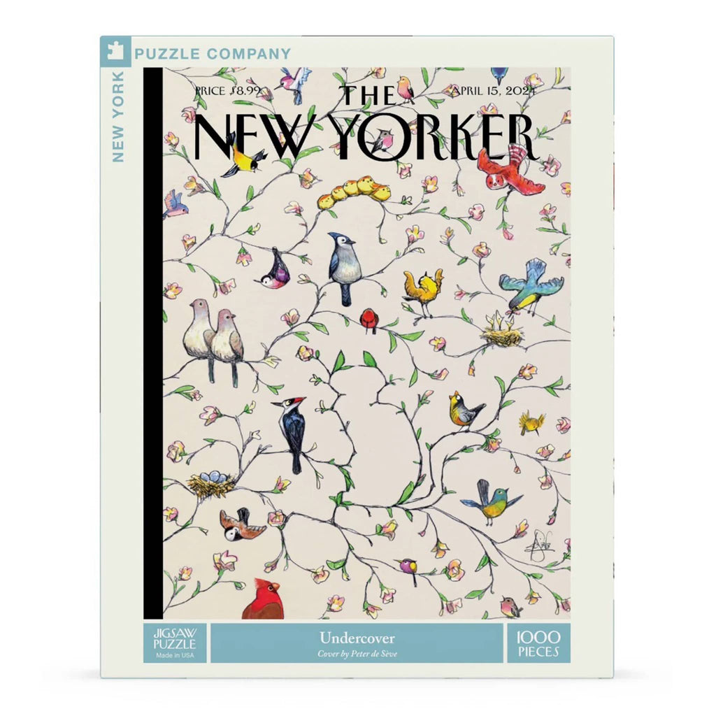 New York Puzzle Company puzzle box with bird design and 'The New Yorker' branding.