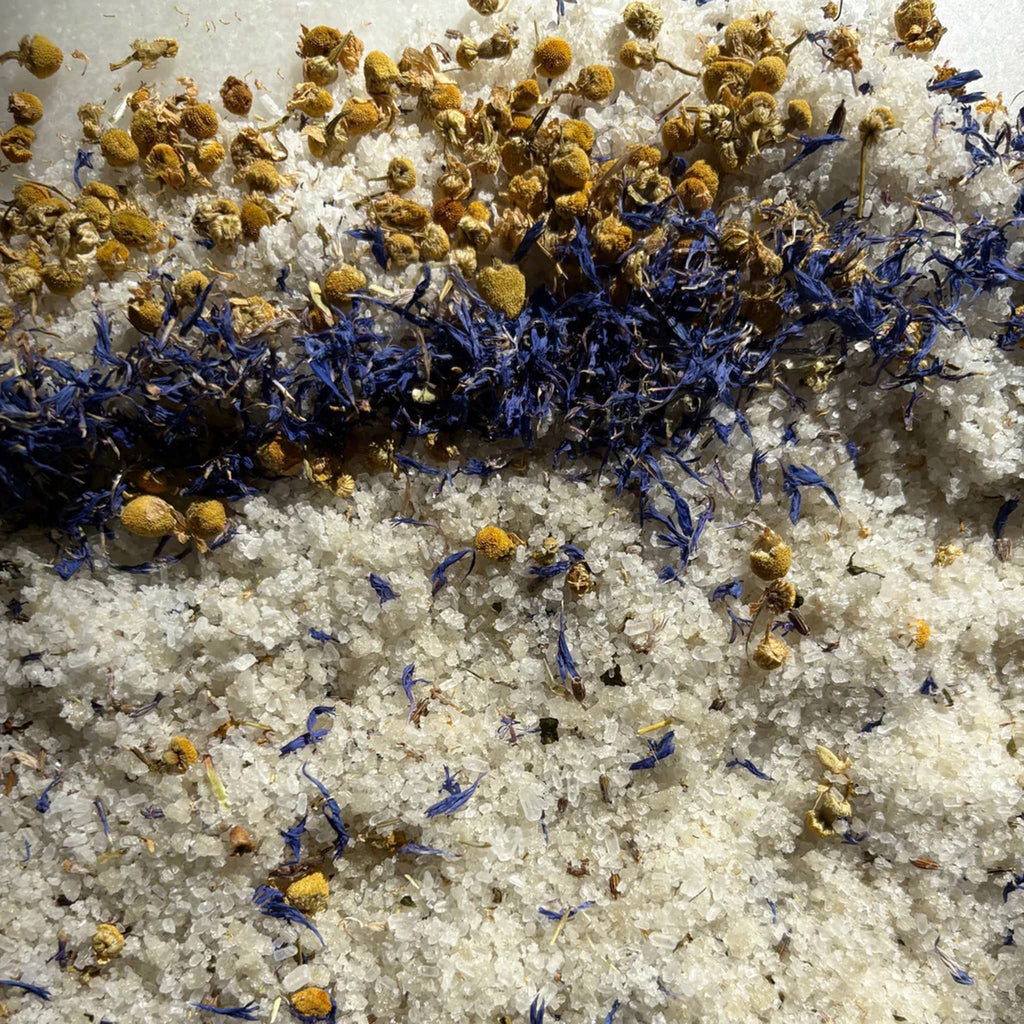 Niteswim Nite-In Botanical Bath Salts spill on a white background.
