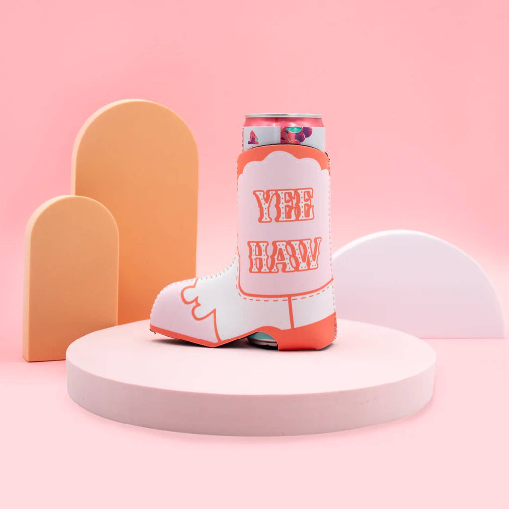 NPW Drinking Buddies Neoprene Slim Can Sleeve that looks like a pink, orange and white cowboy boot, with can on pink and orange background.