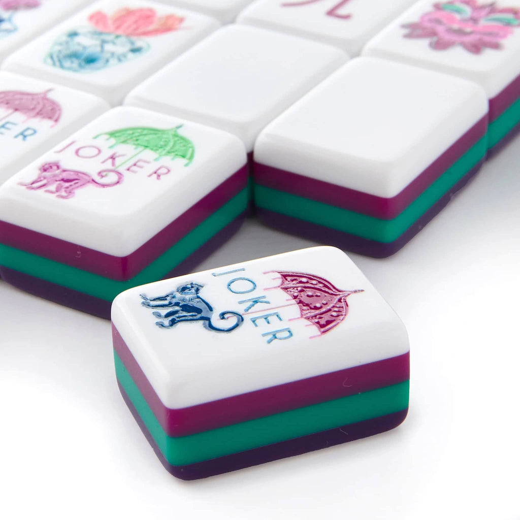 Set of jewel-toned Gemma mahjong tiles, close up of jokers on a white background.