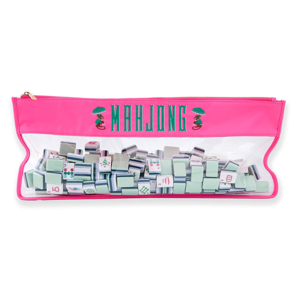 Set of mahjong tiles in a pink case on a white background.