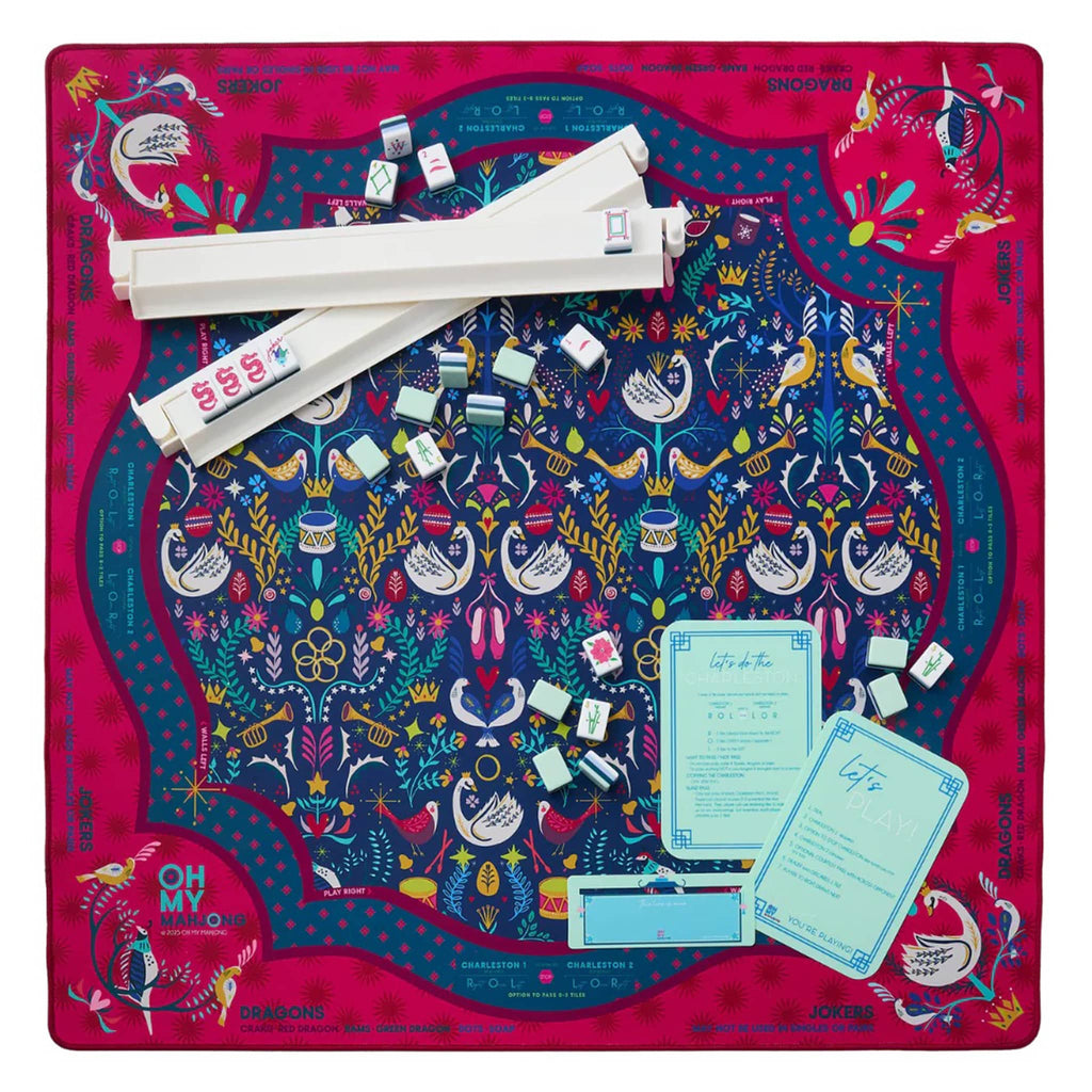 Pear Tree holiday mahjong mat with pear trees, birds and holiday graphics on a blue background with red border, flat, on a white background, with white racks and pushers, blue line finder and mahjong instruction cards.