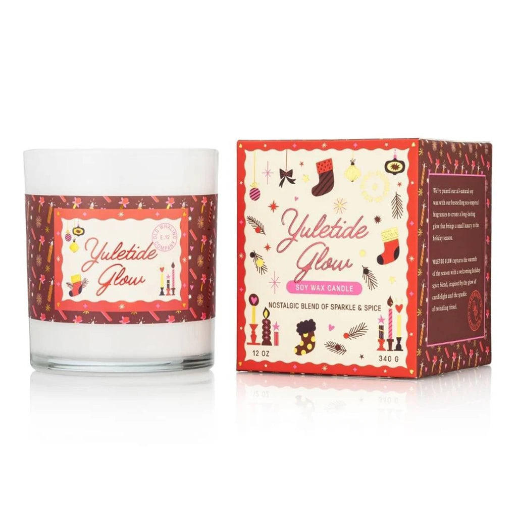 Yuletide Glow candle with packaging on a white background.