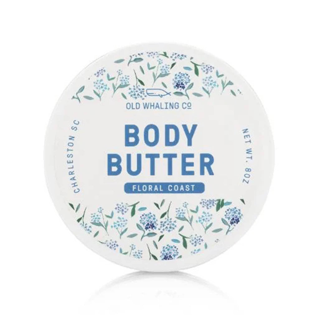 Old Whaling Company Floral Coast 8 ounce scented body butter in white tub with blue hydrangea floral print, top view.