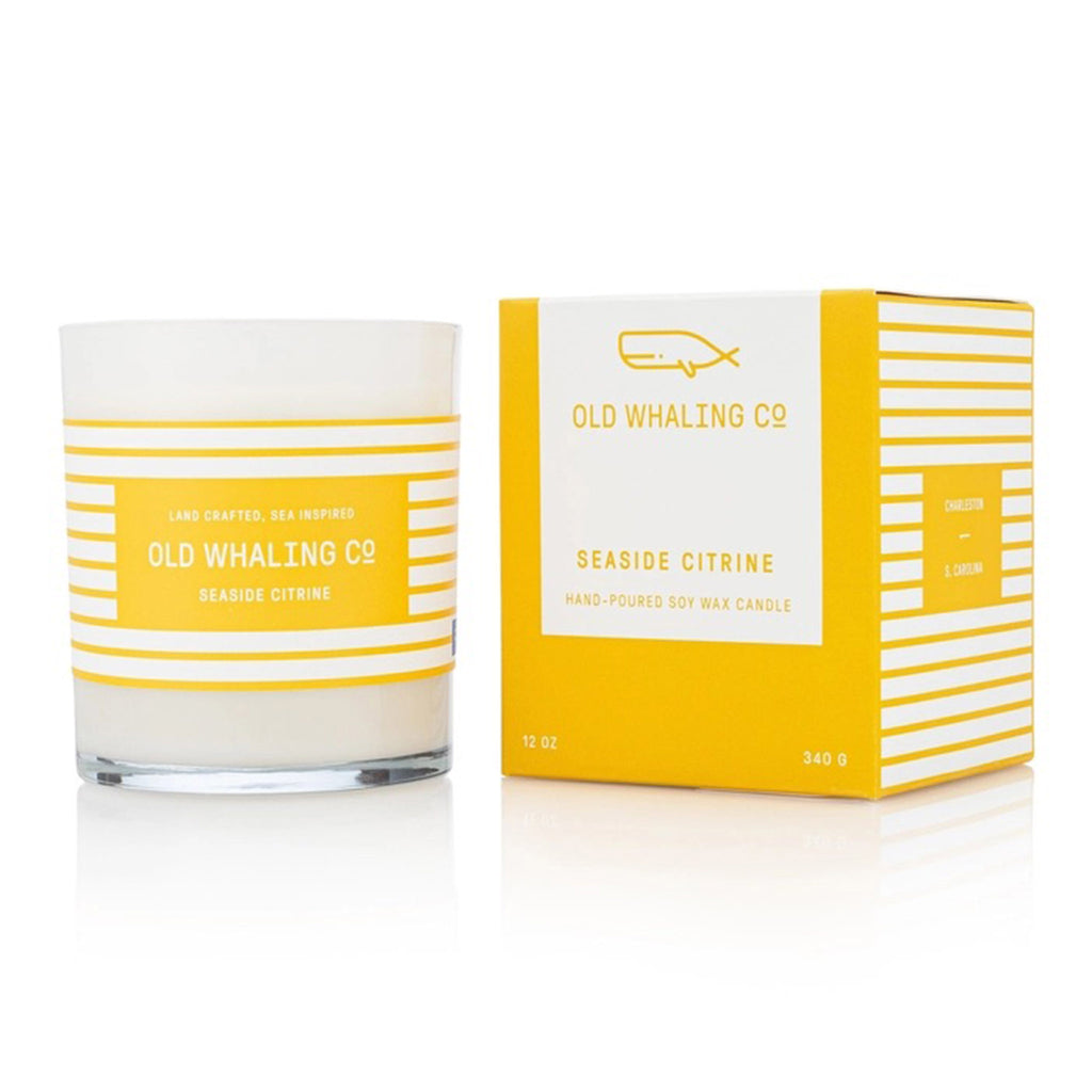 old whaling company seaside citrine scented olive and soy wax candle in opaque glass tumbler with bright yellow gift box.