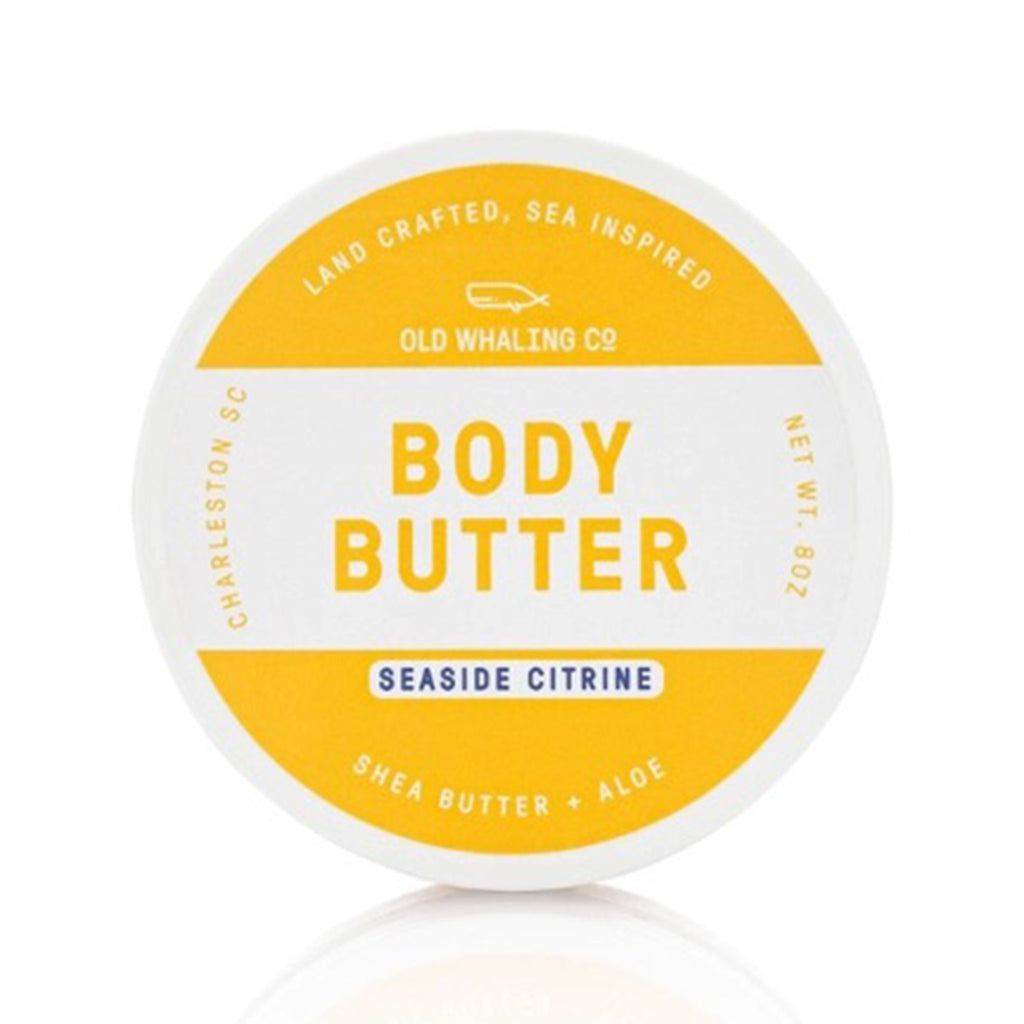 old whaling company seaside citrine scented body butter moisturizer in white 8 ounce tub with yellow and blue writing on top.