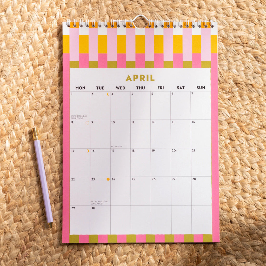 Once Upon A Tuesday 2024 12 month checks and stripes monthly wall calendar A4 size, april sample page with colorful stripe pattern.