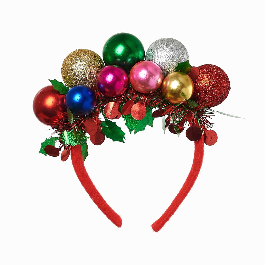 Red decorative headband with colorful ornaments, tinsel and holly, on a white background.
