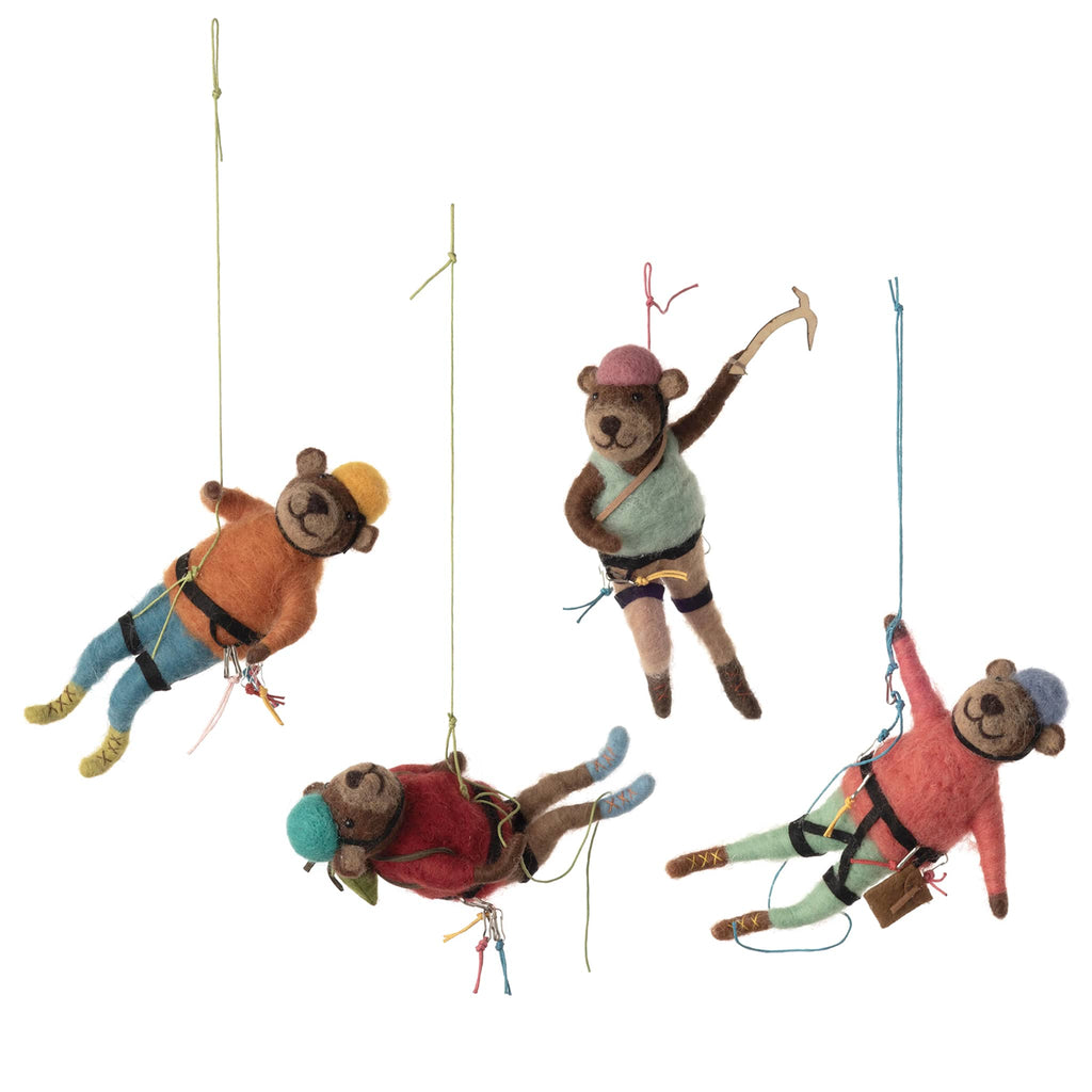 Four bears in mountain climbing gear on a white background.