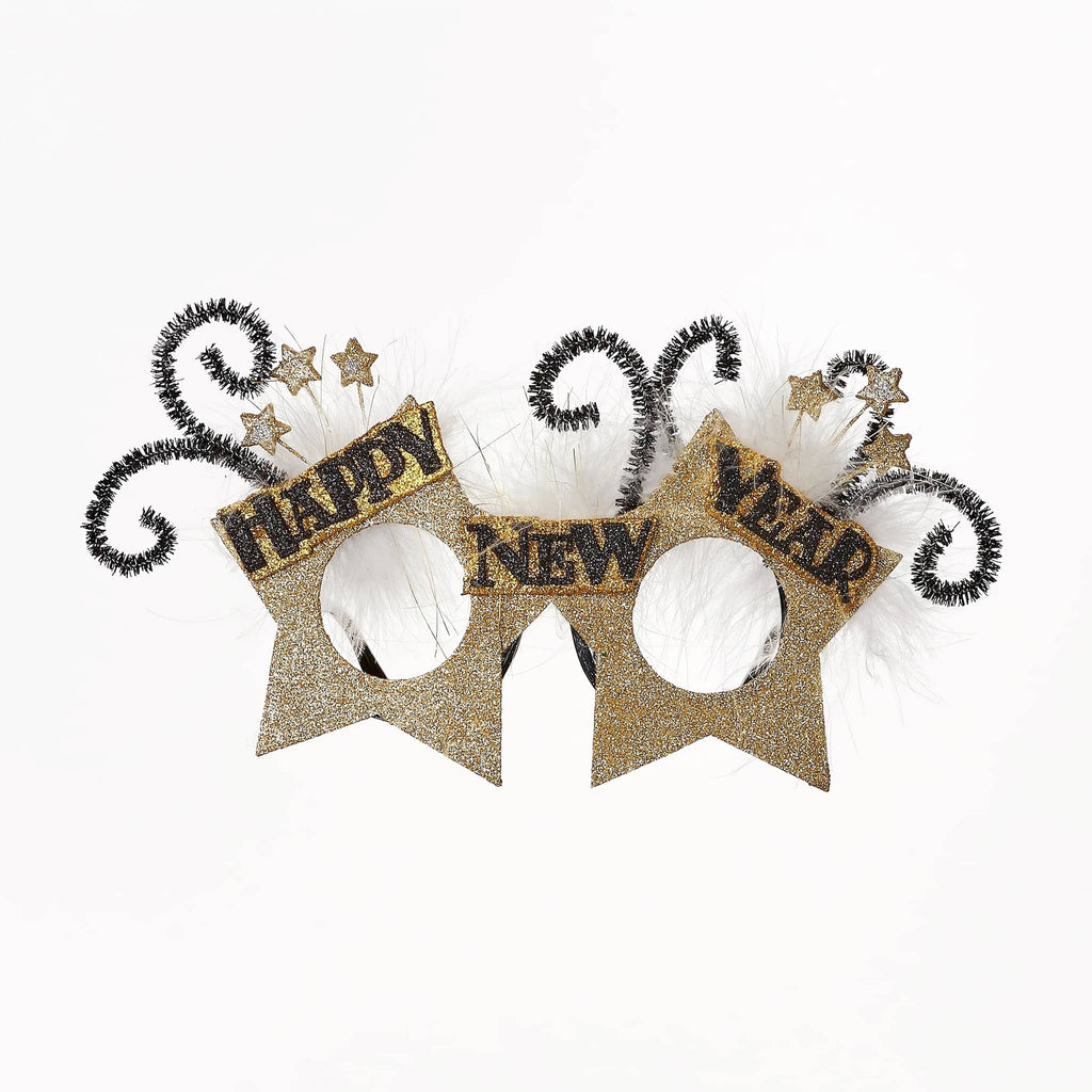 Happy New Year novelty glasses with gold glitter, white feathers and black pipe cleaner swirls.