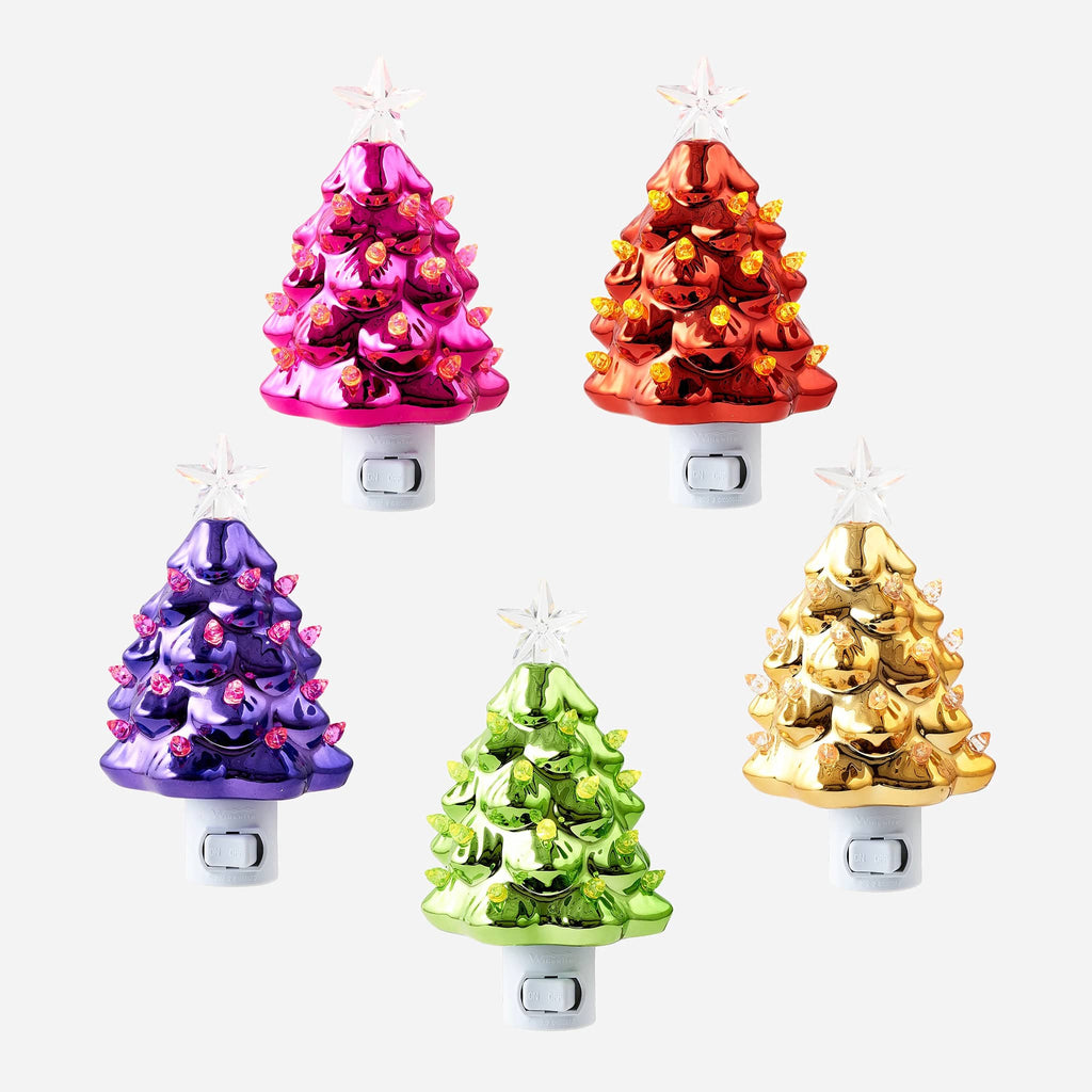 Five colorful Christmas tree-shaped ceramic night lights on a white background.
