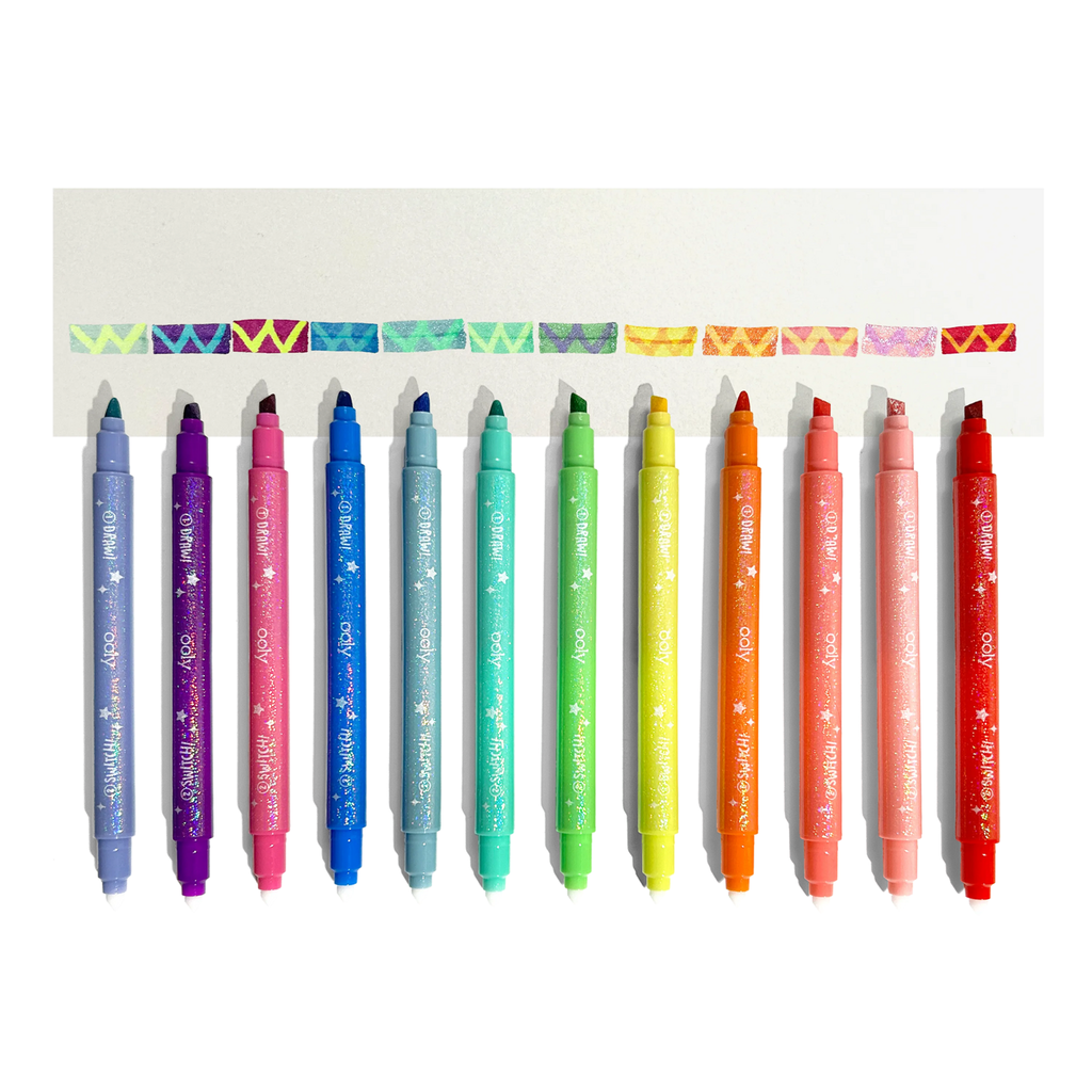 Ooly Switch-eroo Sparkle Glittery Color Changing Markers, set of 12 with caps off and color swatches.